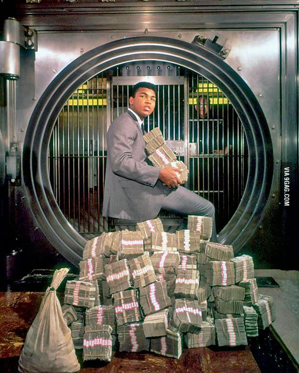 Muhammad Ali with his winnings in 1974.