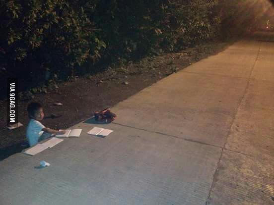 He is from the Philippines. The 9yo is studying in the road near to the lampost cause His family can&#039;t afford electricity #salute