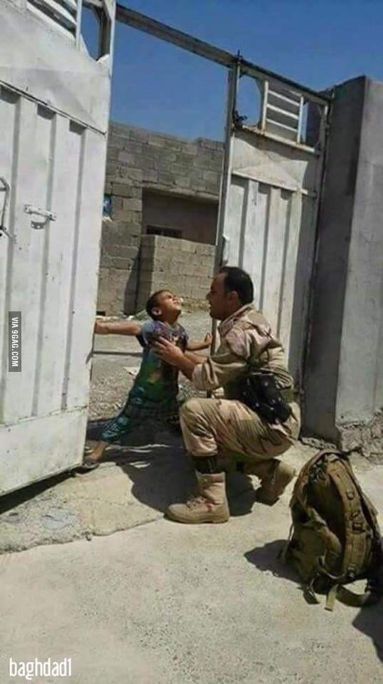 Iraqi child trying to stop his father from leaving the house to fight ISIS