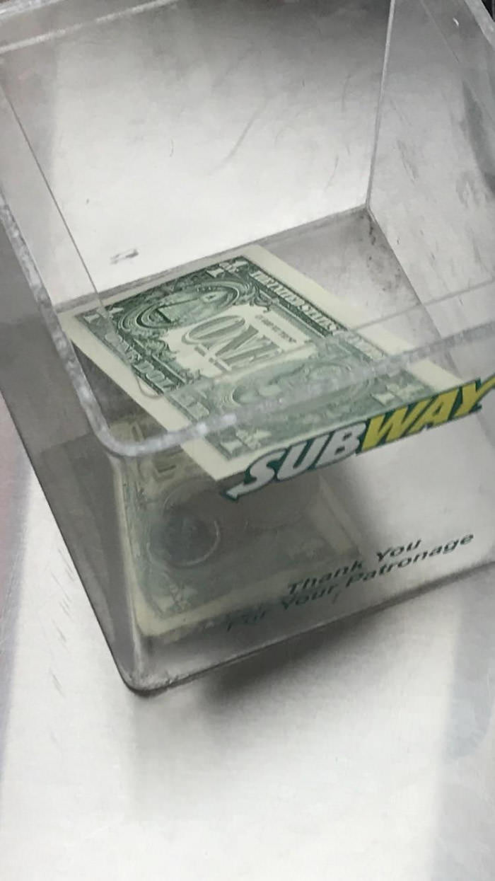 This really crispy dollar in a tip jar