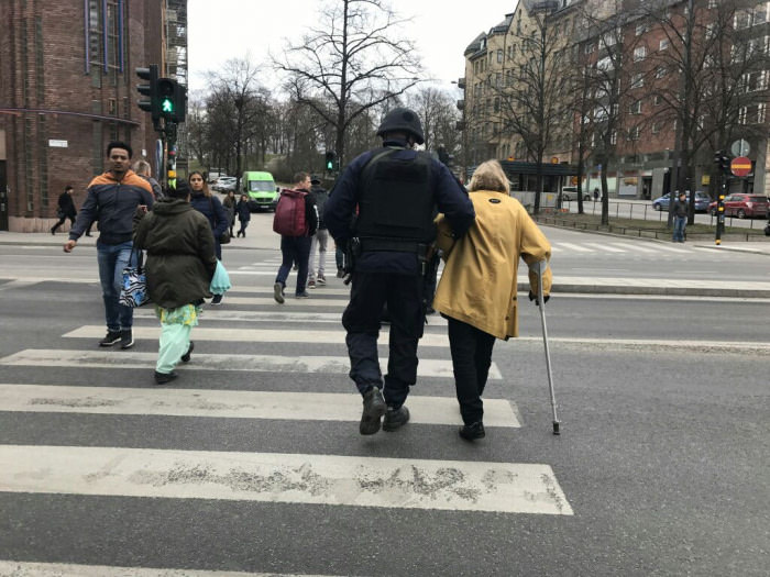 Despite all the horror, there is light - Special unit helping an old lady after the Stockholm attacks