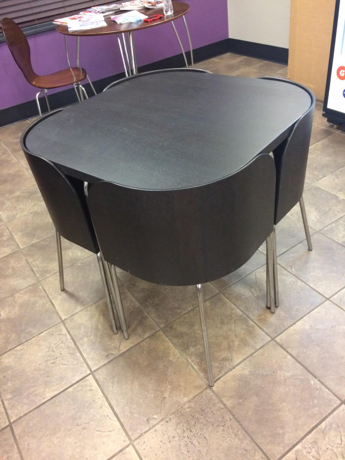 These chairs that fit perfectly underneath the table at my gym.