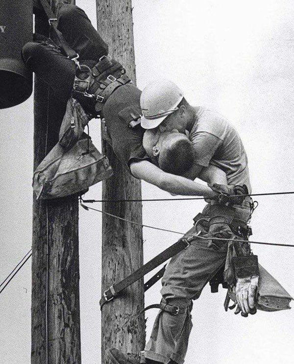 The Kiss Of Life.  A utility worker giving mouth-to-mouth to co-worker after he contacted a high voltage wire, 1967.